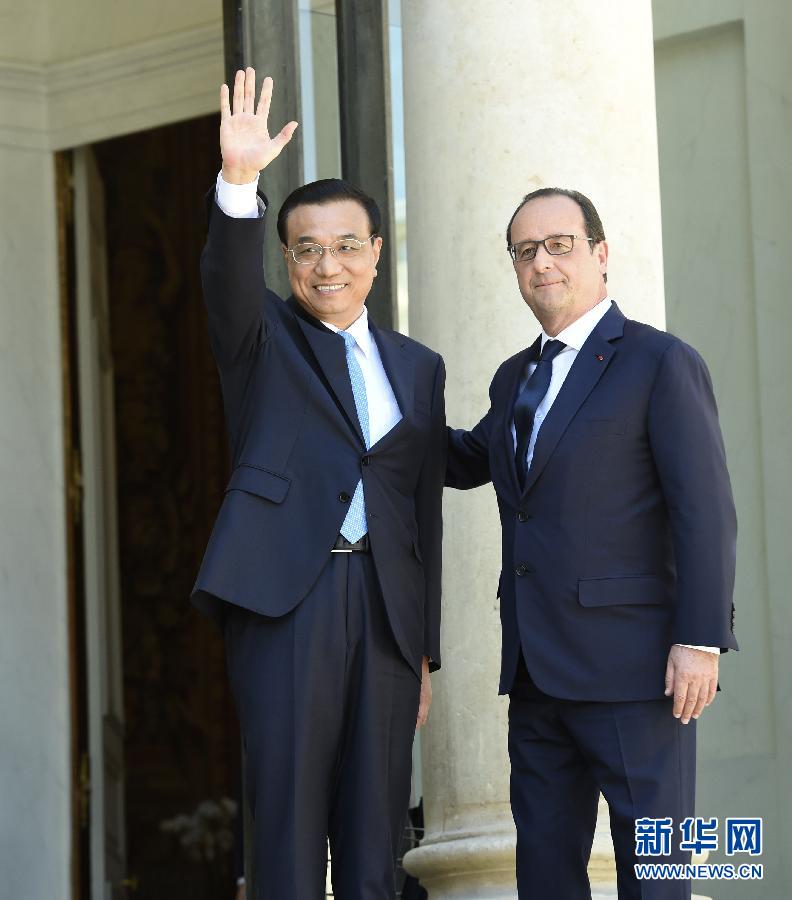 當?shù)貢r間6月30日下午，中國國務院總理李克強在巴黎愛麗舍宮會見法國總統(tǒng)奧朗德。 新華社記者李學仁攝 